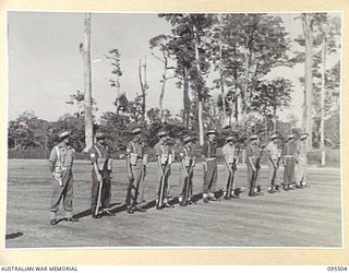 TOROKINA, BOUGAINVILLE, 1945-08-18. SPECIAL PARADE OF B CORPS SIGNALS WHICH WON BOTH THE LOCAL CRICKET AND AUSTRALIAN RULES FOOTBALL COMPETITIONS HELD IN 2 CORPS AREA. THE UNIT WAS INSPECTED BY ..
