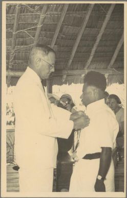 Wesley receives his decoration [from Brigadier Cleland] for services at Mt Lamington, 24 November 1952