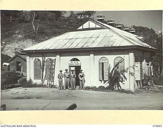 PORT MORESBY, PAPUA. 1944-07-28. THE MAIN NAVAL STORE OF THE RAN BASE STORE, HMAS "BASILISK". IDENTIFIED PERSONNEL ARE:- PAY LIEUTENANT L.W. SLADE (1); MR ALWAY, WARRANT SUPPLY OFFICER (2); PAY SUB ..