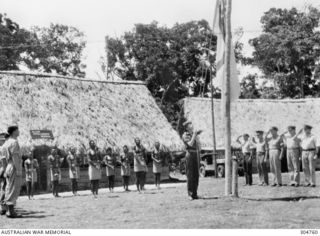 GOODENOUGH ISLAND, NEW GUINEA. 1944-01-01. ALLIED INTELLIGENCE BUREAU (AIB) PERSONNEL AT AIB HEADQUARTERS AT COLOURS. INCLUDED IN THE PHOTOGRAPH ARE LIEUTENANTS (SPECIAL BRANCH) C. W. DUKE-YONGE ..