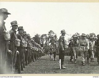 LAE, NEW GUINEA, 1944-03-08. VX20308 MAJOR-GENERAL F.H. BERRYMAN, CBE, DSO (1), GENERAL OFFICER COMMANDING 2ND AUSTRALIAN CORPS, INSPECTING UNITED OF THE 29TH INFANTRY BRIGADE. THE BRIGADE HAS BEEN ..