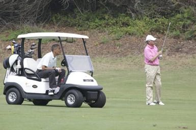 Barack Obama plays golf with Prime Minister Najib Razak, Joe Paulsen, and Mike Brush in Kaneohe Bay, Hawaii, December 24, 2014
