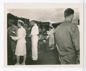 [Service Men and Women Passing Out Papers at Presentation of Purple Heart]