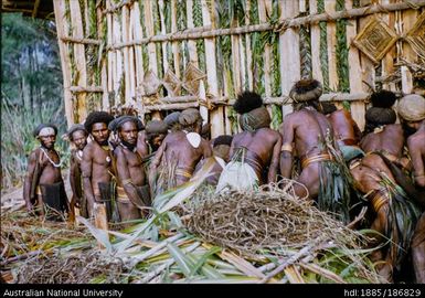 Group of men against building wall