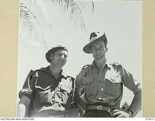 LAE, NEW GUINEA. 1944-09-06. CAPTAIN R.M. BALDWIN, PRINCESS PATRICIA CANADIAN LIGHT INFANTRY (1) AND CAPTAIN L. ARCHIBALD, ROYAL HIGHLAND CANADIAN BLACK WATCH (2) CANADIAN OBSERVERS WITH THE ..