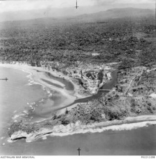 Aitape, New Guinea. 1945-01. Aerial photograph looking south east, of the 2/11th Australian General Hospital (2/11AGH) by the side of the Aitape River. In an area prone to flooding note how close ..