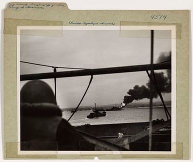 Photograph of a Crewman Watching a Flash of Flame Burst from the Bow of a Gasoline Barge