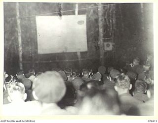 MOTUPINA POINT, BOUGAINVILLE ISLAND. 1945-01-18. A SECTION OF THE AUDIENCE DURING THE FIRST OPEN AIR SHOW PROVIDED BY THE AMENITIES SERVICE OF THE 29TH INFANTRY BRIGADE
