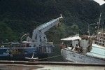 View of the rear section of the research ship R/V Argo moored in Pago Pago Harbor. Pago Pago, the capital town of American Samoa. It is actually a village that is often mistaken to be a city (as in a capital or port city) of this south Pacific territory of the United States of America. The village is located on Pago Pago Harbor, in the island of Tutuila. Circa 1967