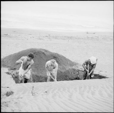 Workers digging a hole at a gold mine site, Fiji, 1966 / Michael Terry