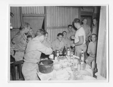 [Soldiers Drinking by Serving Table]