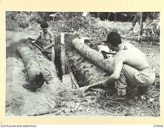 TSIMBA AREA, BOUGAINVILLE ISLAND. 1945-02-07/06. Q126021 PRIVATE E. EALTERS, ALLIED TRANSLATOR AND INTELLIGENCE SERVICE (1) AND SERGEANT M. MASUMOTO, USA (2) ATTACHED TO THE ALLIED TRANSLATOR AND ..