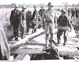 BUNA, PAPUA, 1942-12-05. US ARMY TROOPS BUILD A BRIDGE ACROSS SEMINI CREEK. THE BRIDGE WAS USED FOR AN ATTACK ON BUNA AIRSTRIP. (PHOTOGRAPHER: G. SILK)