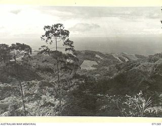 WAREO AREA, NEW GUINEA. 1944-03-18. ONE OF TWO PHOTOGRAPHS FORMING A PANORAMA VIEWING NORTH TOWARDS FORTIFICATION POINT FROM THE 2,200 FEET FEATURE. (JOINS WITH NO.71268)