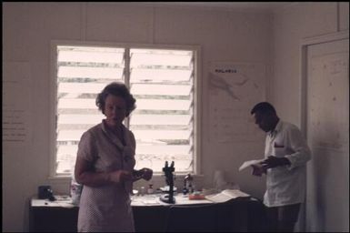 In the laboratory (Margaret Spencer with Jonathan Baloiloi) (1) : Bougainville Island, Papua New Guinea, April 1971 / Terence and Margaret Spencer