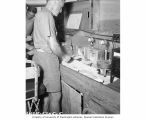 Dr. Lauren R. Donaldson testing fish for radioactive content, summer 1947