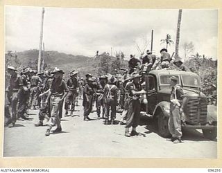 MALAGUNA MISSION, NEW BRITAIN. 1945-09-10. TROOPS OF 4 INFANTRY BRIGADE USING JAPANESE TRUCKS TO TRANSPORT SUPPLIES TO UNIT AREAS, DURING THE FIRST DAY OF OCCUPATION OF THE RABAUL AREA, FOLLOWING ..