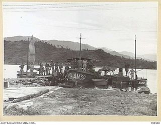 SALAMAUA, NEW GUINEA. 1945-11-03. MEMBERS OF 2 MARINE FOOD SUPPLY PLATOON WITH THEIR BOATS. THE UNIT HAS BUILT THREE 18-FOOT POWER BOATS, FIVE 16-FOOT NETTING DINGHEYS AND TWO TEN-FOOT NETTING ..