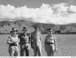 RAMU VALLEY, NEW GUINEA. 1943-10-01. SENIOR AIF OFFICERS INSPECTING A NEWLY COMPLETED AIRSTRIP. LEFT TO RIGHT:- LIEUTENANT GENERAL SIR EDMUND HERRING KBE, DSO, MC, ED, GENERAL OFFICER COMMANDING, ..