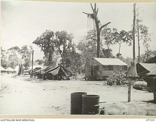 TOROKINA, BOUGAINVILLE ISLAND. 1944-11-25. THE REGIMENTAL AID POST, CAMP COMMANDANTS OFFICE ORDERLY ROOM, OFFICER'S TENT LINES AND E AND F MESSES IN THE TEMPORARY CAMP OF HEADQUARTERS, 2ND ..