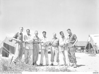 BORAM BEACH, NEW GUINEA. 1945-10-17. INDIAN AND AUSTRALIAN SOLDIERS OUTSIDE A HOSPITAL WARD, 2/15 FIELD AMBULANCE. THE INDIAN SOLDIERS WERE LIBERATED FROM THE JAPANESE IN THE SEPIK RIVER AREA AND ..