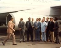 Claude Pepper with other men in front of a plane