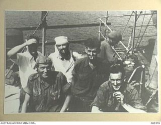 PORT MORESBY, NEW GUINEA. 1942-04-12. EVACUEES FROM NEW BRITAIN RELAXING ON THE DECK OF THE HMAS "LAURABADA" AS THE SHIP DRAWS INTO THE WHARF. THESE EVACUEES, SERVICE PERSONNEL AND CIVILIANS, TOOK ..