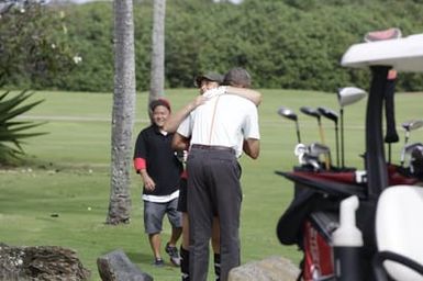 Barack Obama plays golf with Prime Minister Najib Razak, Joe Paulsen, and Mike Brush in Kaneohe Bay, Hawaii, December 24, 2014