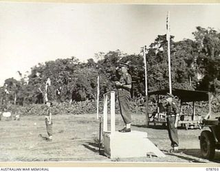 BOUGAINVILLE ISLAND. 1945-01-26. VX38969 MAJOR-GENERAL W. BRIDGEFORD, CBE, MC GENERAL OFFICER COMMANDING, 3RD DIVISION TAKING THE SALUTE FROM TROOPS OF HEADQUARTERS, 15TH INFANTRY BRIGADE ON HIS ..