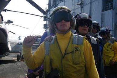 Aviation Boatswains Mate Third Class (AB3) Scoville practices fire fighting procedures during a general quarters drill onboard the USS SAIPAN (LHA 2)