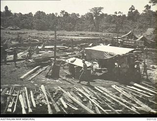 AITAPE, NORTH EAST NEW GUINEA. C. 1944-06. A RAAF SAWMILL, ESTABLISHED BY NO. 7 MOBILE WORKS SQUADRON RAAF SHORTLY AFTER THE LANDING IN THE AITAPE AREA, WHICH CUT LARGE QUANTITIES OF TIMBER FOR USE ..