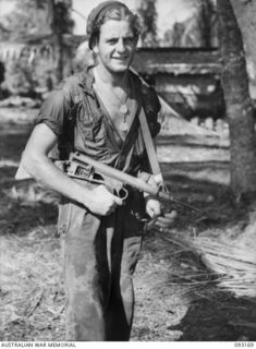 MOROKAIMORO, BOUGAINVILLE, 1945-06-12. TPR A. LEE, A TROOP, 2/8 COMMANDO SQUADRON, ON HIS RETURN FROM AN EIGHT DAY PATROL TO DIO DIO ON THE COAST. THE SQUADRON, ASSISTED BY NATIVES OF THE AREA, IS ..