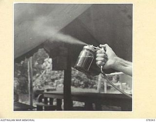 TOROKINA, BOUGAINVILLE ISLAND. 1945-01-17. A CLOSE-UP OF THE MODEL "L" SPRAY GUN USED BY A PERSONNEL OF THE 19TH MALARIAL CONTROL UNIT AND THE 2/1ST MALARIAL CONTROL UNIT WHEN SPRAYING STAGNANT ..