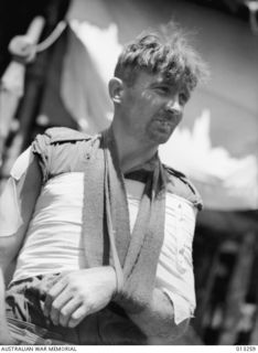 WX14316 PRIVATE HAROLD REGINALD NASH, 2/16 BATTALION, OF SUBIACO, WA, A WESTRALIAN TYPICAL OF THE TOUGH INFANTRYMEN RECRUITED FROM THIS STATE. WOUNDED DURING A JUNGLE CLASH WITH THE JAPANESE IN THE ..