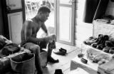 Malaysia, Republic of Fiji Military Forces member shining shoes at camp