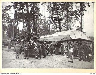 JACQUINOT BAY, NEW BRITAIN, 1945-08-11. PERSONNEL OF HEADQUARTERS 11 DIVISION DEBUSSING AT 5 DIVISION RECEPTION CAMP. THEY ARE RELIEVING HEADQUARTERS 5 DIVISION TROOPS WHO ARE RETURNING TO THE ..