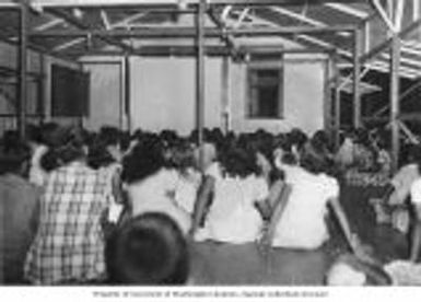 Marshallese children gathered in the Catholic Mission on Likiep Atoll for a movie night, August 20, 1949