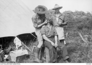 DENTAL TREATMENT AT MYOLA, NEW GUINEA. PHOTOGRAPH PUBLISHED IN AUSTRALIA IN THE WAR OF 1939-45, MEDICAL, VOL 1, CLINICAL PROBLEMS OF WAR, PAGE 616