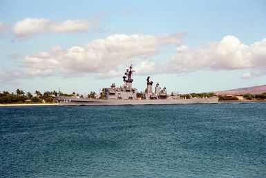 A port view of the Japanese destroyer ASAKAZE (DD 169) departing Pearl Harbor through the channel.