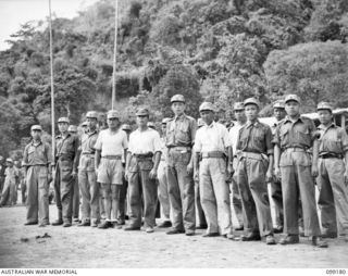 RABAUL, NEW BRITAIN, 1945-11-30. CHINESE SOLDIERS ASSEMBLED READY FOR THE IDENTIFICATION PARADE OF SUSPECTED JAPANESE WAR CIMINALS, AT THE CHINESE ARMY CAMP