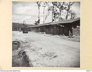 BORAM, NEW GUINEA. 1945-08-06. THE ADVANCED SUPPLY DEPOT WHERE AUSTRALIAN ARMY SERVICE CORPS SUPPLIES ARE STORED IN BULK AFTER BEING UNLOADED BY HEADQUARTERS COMMAND, AUSTRALIAN ARMY SERVICE CORPS, ..