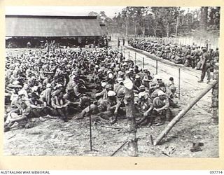 TOROKINA, BOUGAINVILLE. 1945-09-22. JAPANESE TROOPS FROM NAURU ISLAND, ON ARRIVAL AT TOROKINA PER SS RIVER BURDEKIN AND SS RIVER GLENELG, WERE MARCHED ALONG THE PIVA ROAD TO THE PRISON COMPOUND AT ..