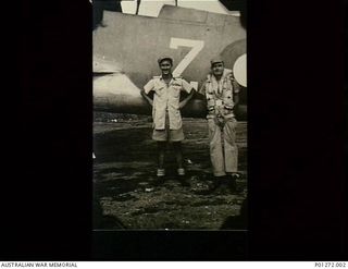 404733  Flying Officer (FO) John Robert Newman and 43192 FO William George Robert Binnie, a No. 30 Squadron RAAF Beaufighter crew, beside their aircraft at Vivigani airstrip, Papua. On 9 September ..