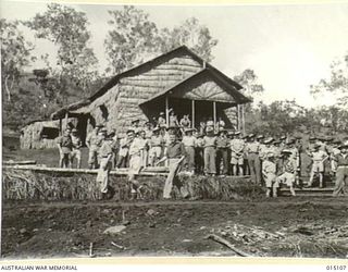 1943-06-25. NEW GUINEA. ST PATRICK'S ROMAN CATHOLIC CHURCH. SOLDIERS LEAVING THE CHURCH AFTER THE CELEBRATION OF THE FIRST MASS. (NEGATIVE BY N. BROWN)