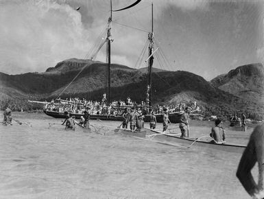 [View from a Pacific Island of a boat with many people]