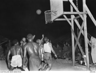 MUNDA, NEW GEORGIA. 1945-03-27. A BASKETBALL GAME BETWEEN AMERICAN COLOURED SERVICEMEN AND A TEAM FROM D COMPANY, 7 INFANTRY BATTALION, AT THE UNIT LINES