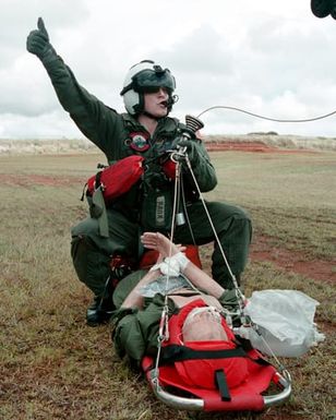 Hospital Corpsman Third Class (HM3) Raymond Munn, Helicopter Combat Support Squadron Five (HCSS5), from Cheyenne, Wyoming, gives the "thumbs up", showing he is ready to hoist a victim up for rescue