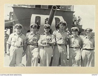 LANGEMAK BAY, NEW GUINEA. 1944-10-23. OFFICERS OF THE RAN CORVETTE, GYMPIE, ON THE FOREDECK