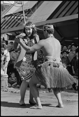 Air New Zealand staff member Sandy Walker dancing with a member of the Rarotongan Te Ivi Maori Dance Troupe