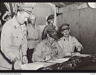 TOROKINA, BOUGAINVILLE. 1945-09-08. LIEUTENANT-GENERAL (LT-GEN) S. G. SAVIGE, GENERAL OFFICER COMMANDING 2 CORPS, ACCEPTED THE SURRENDER OF ALL JAPANESE FORCES ON BOUGAINVILLE FROM LT-GEN M. KANDA, ..